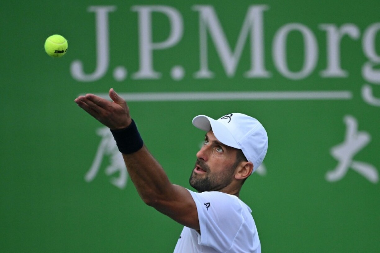 Novak Djokovic serves during a training session at the Shanghai Masters