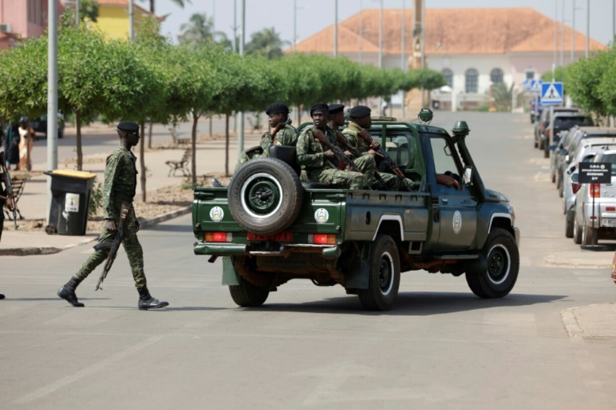 Men in military uniform took over the main road leading to the presidential palace