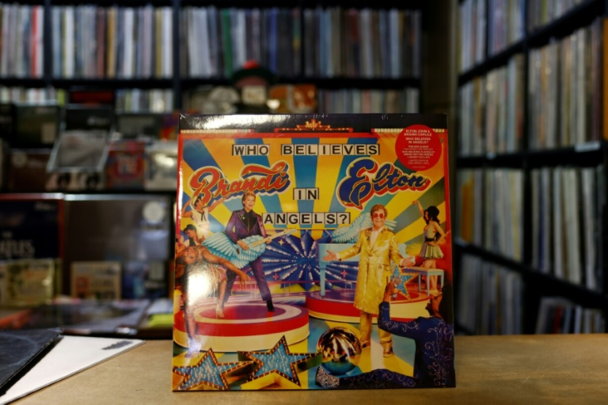 A copy of 'Who Believes in Angels?', the new album from British pop legend Elton John with US singer Brandi Carlile, is displayed inside Sister Ray Records in central London
