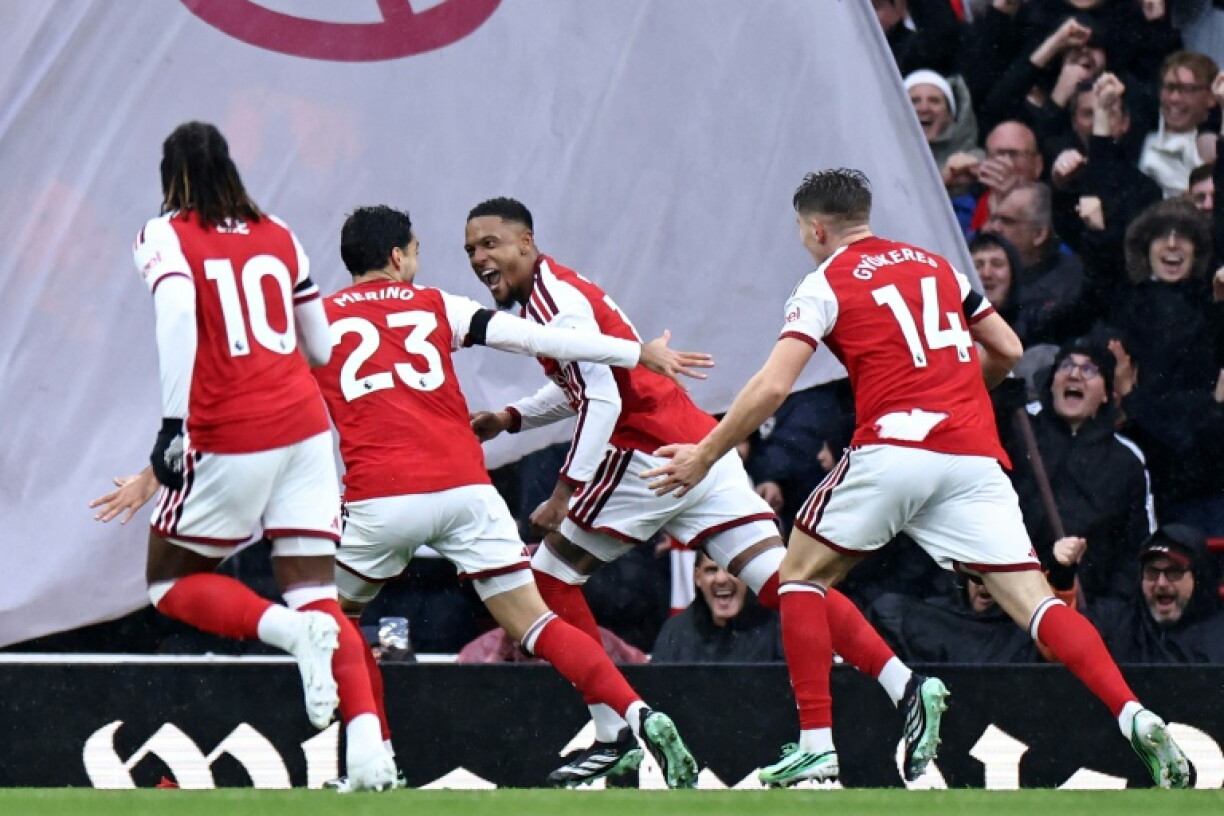 Arsenal defender Ezri Konsa (centre) celebrates with teammates after scoring against Everton at the Emirates