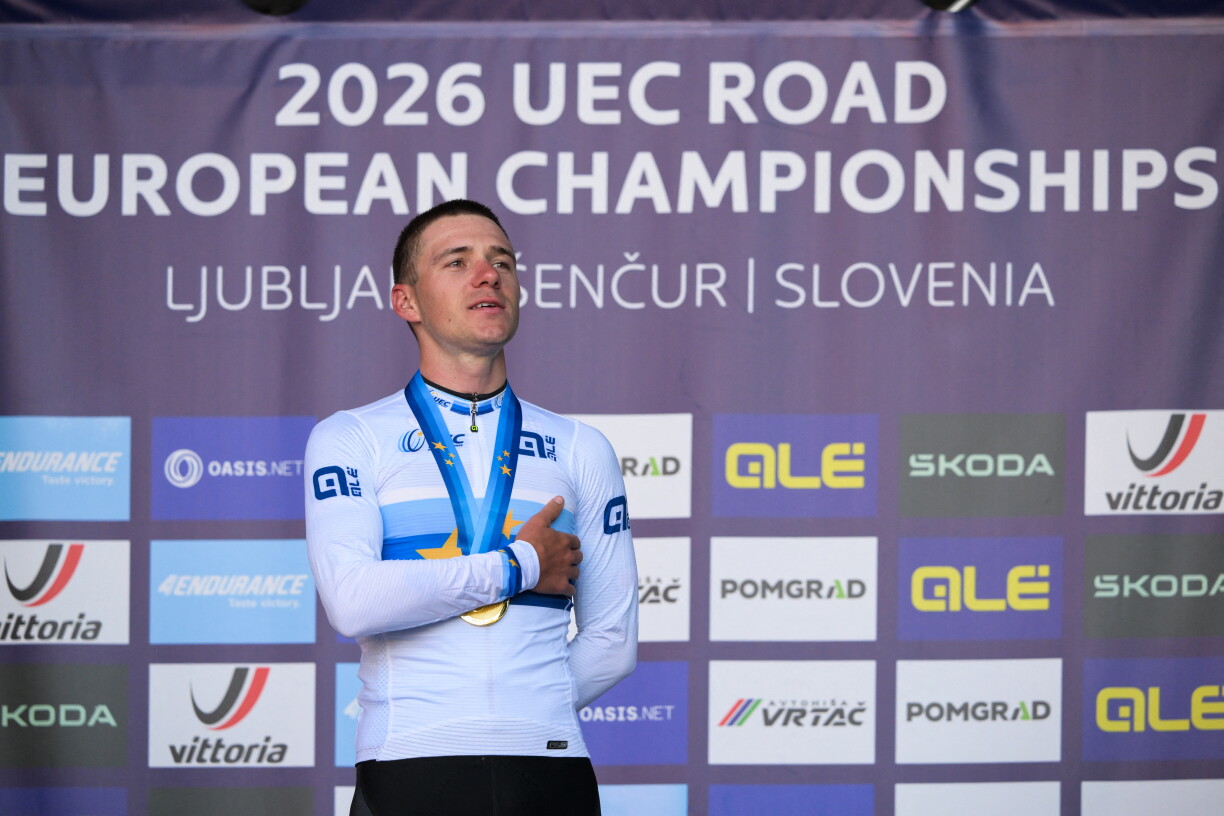 Gold medallist Belgium's rider Remco Evenepoel celebrates on the podium with his medal after winning the men's elite road race of the UEC European Road Cycling Championships in Sencur, near Ljubljana, Slovenia, on October 4, 2026. (Photo by JURE MAKOVEC / AFP)