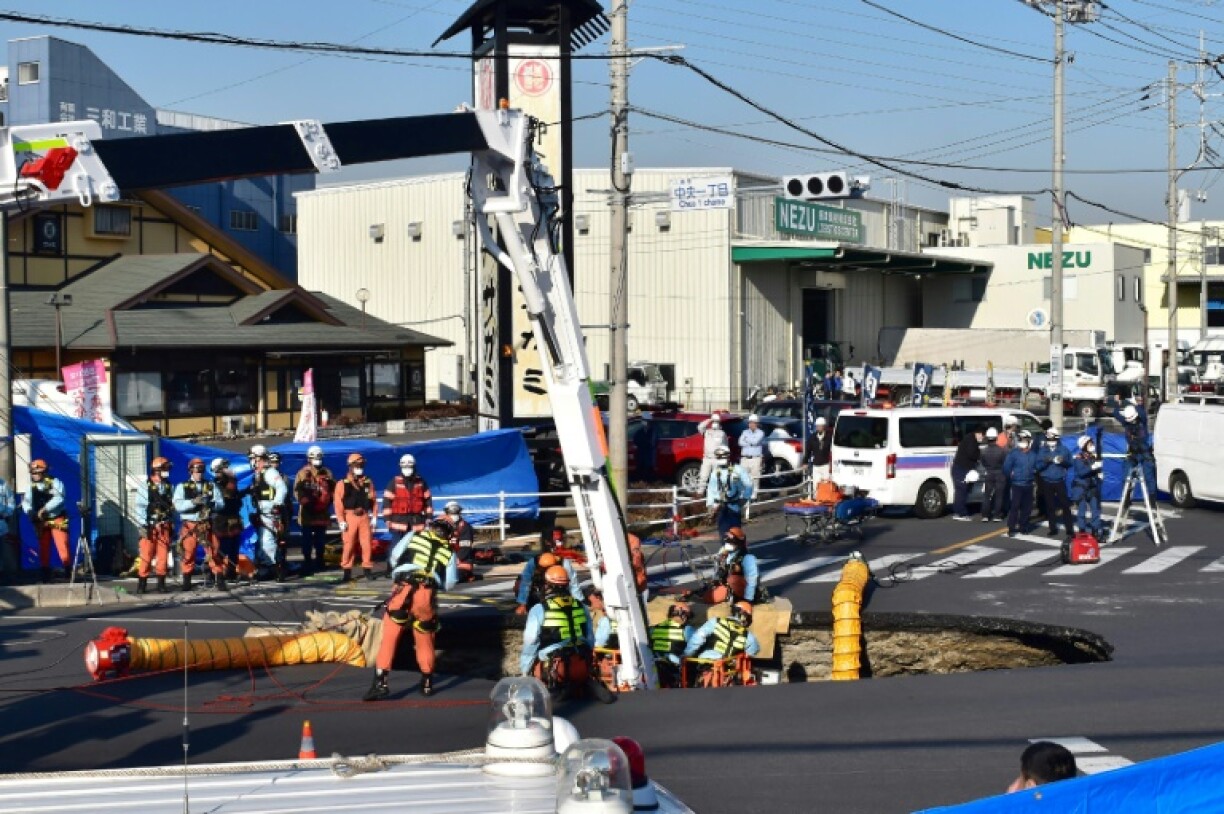 The sinkhole suddenly opened up during morning rush hour an intersection north of Tokyo, swallowing the lorry