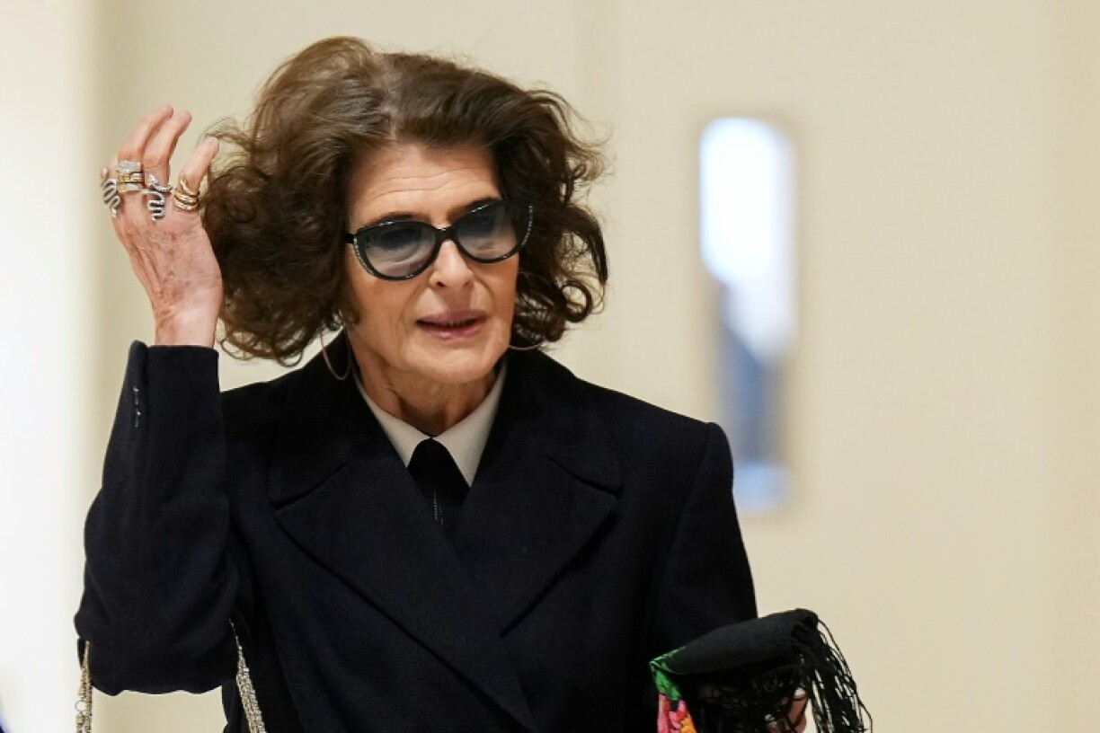 French actress Fanny Ardant gestures as she arrives to attend the trial of French actor Gerard Depardieu