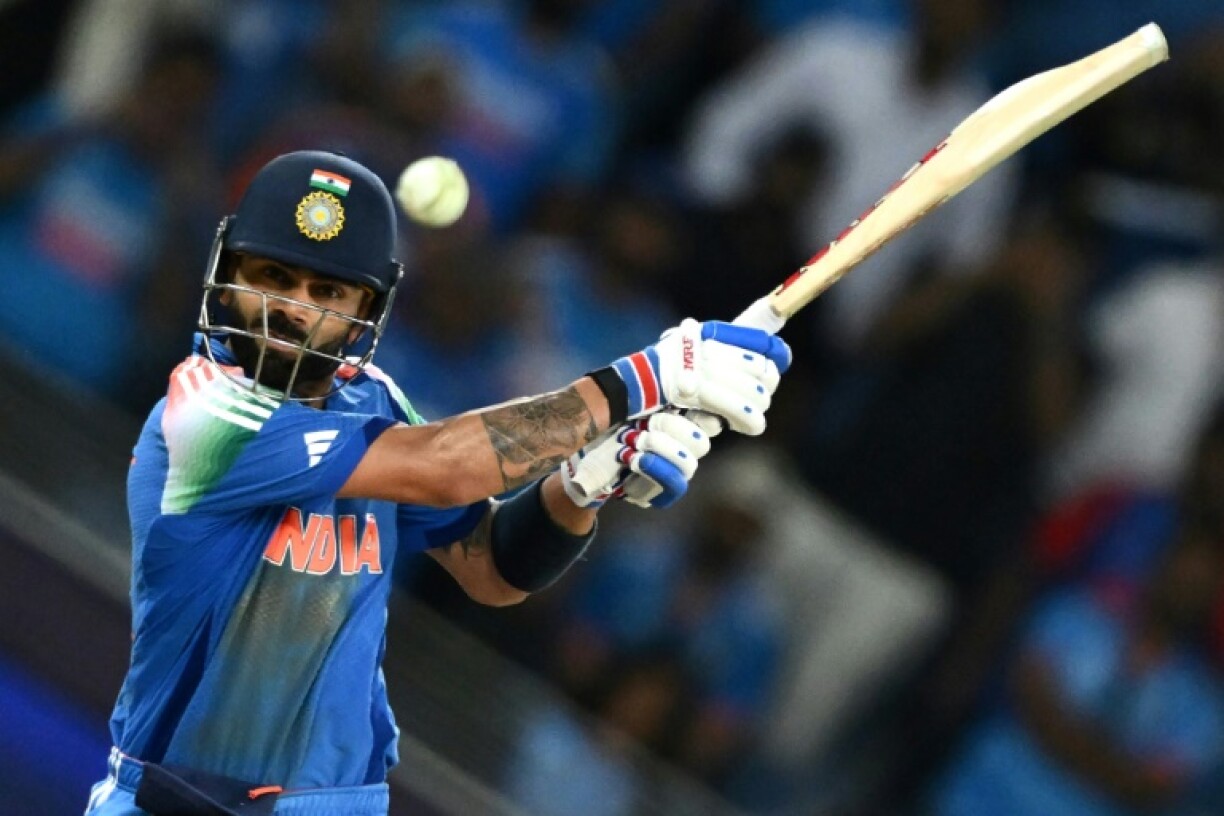 Shutting out the 'noise': India's Virat Kohli hits the winning boundary and completes his hundred on Sunday