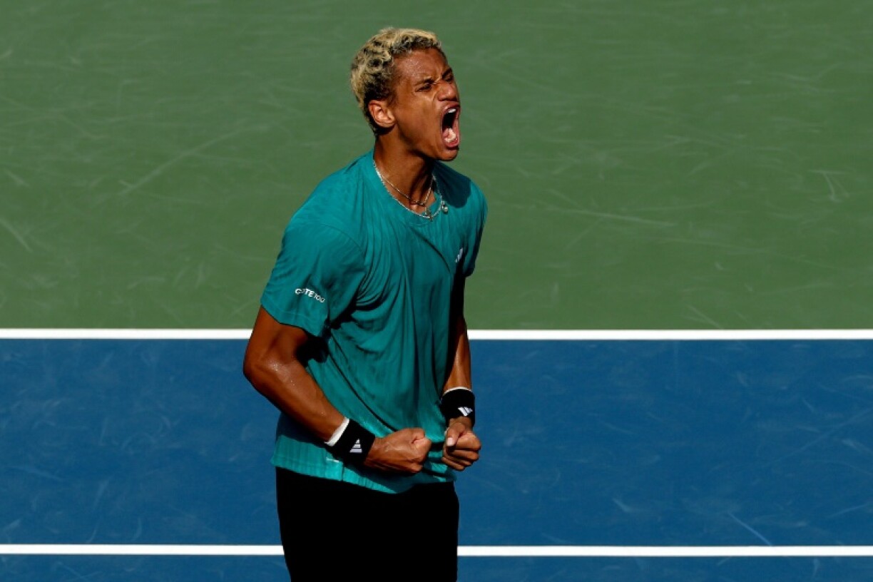 Gabriel Diallo of Canada celebrates his win against Matteo Gigante of Italy at the Toronto ATP Masters