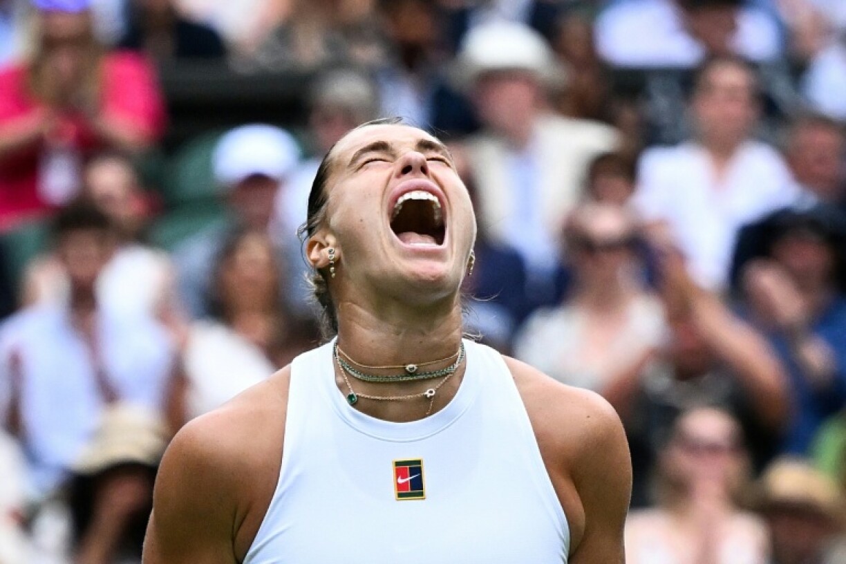 Top seed Aryna Sabalenka lets out a roar during her Wimbledon second-round match against Marie Bouzkova
