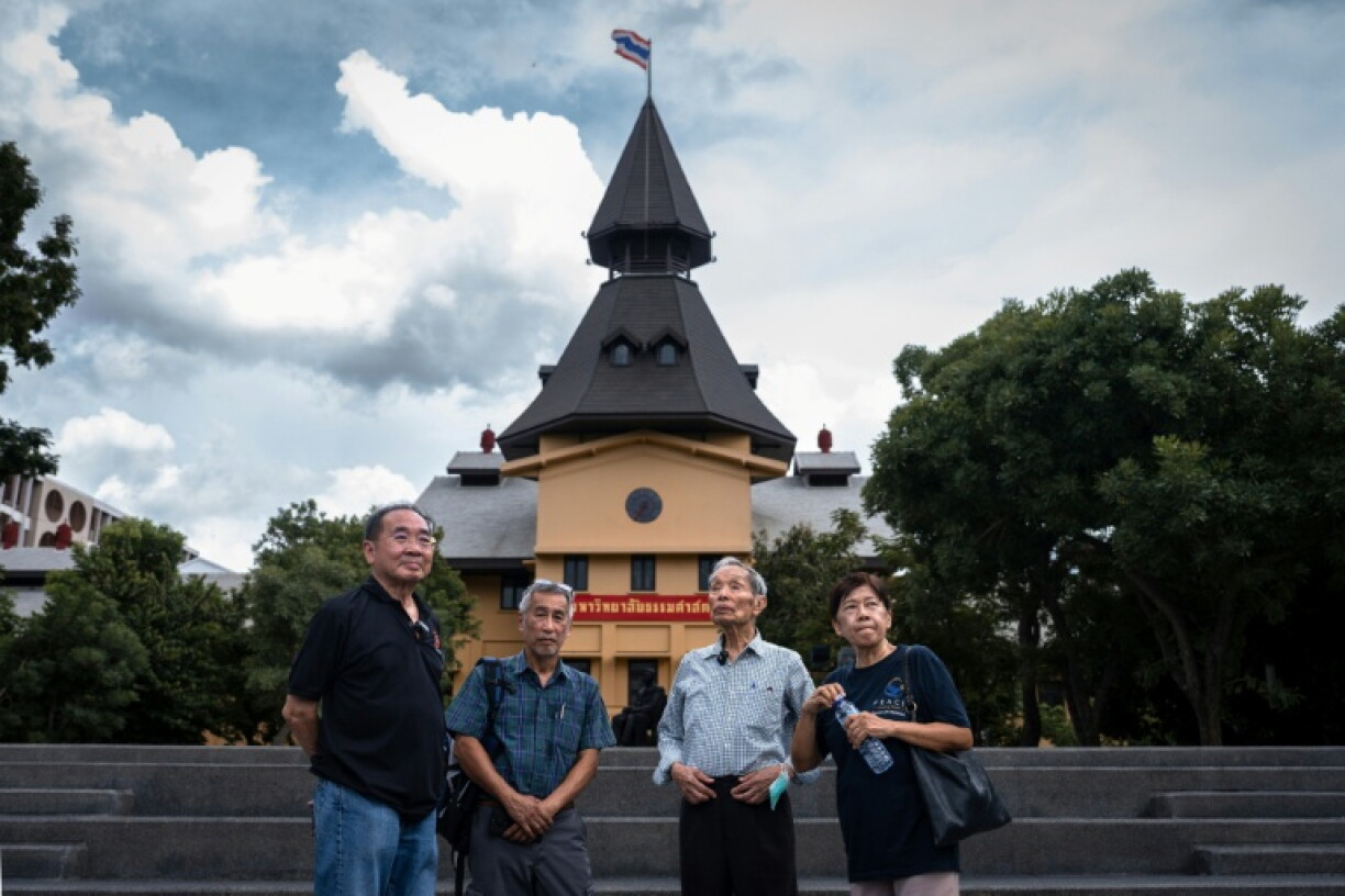 Survivors of the 1976 Thammasat University massacre Kritsadang Nutcharat (L), Apinan Buahapakdi (2nd L) and Julalak Poogird (R), and the institution's then-vice rector Charnvit Kasetsiri (2nd R), share memories during a commemoration in September 2026
