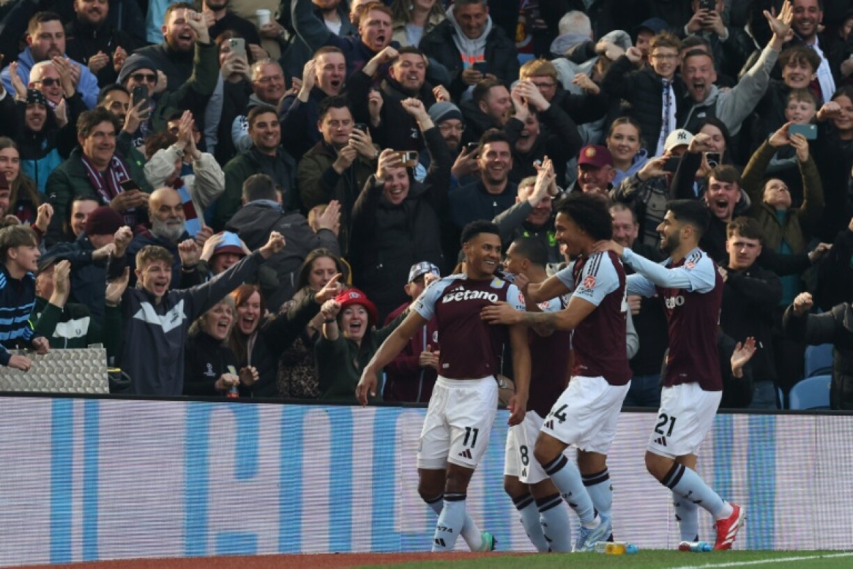 Aston Villa's Ollie Watkins (L) celebrates after scoring against Newcastle