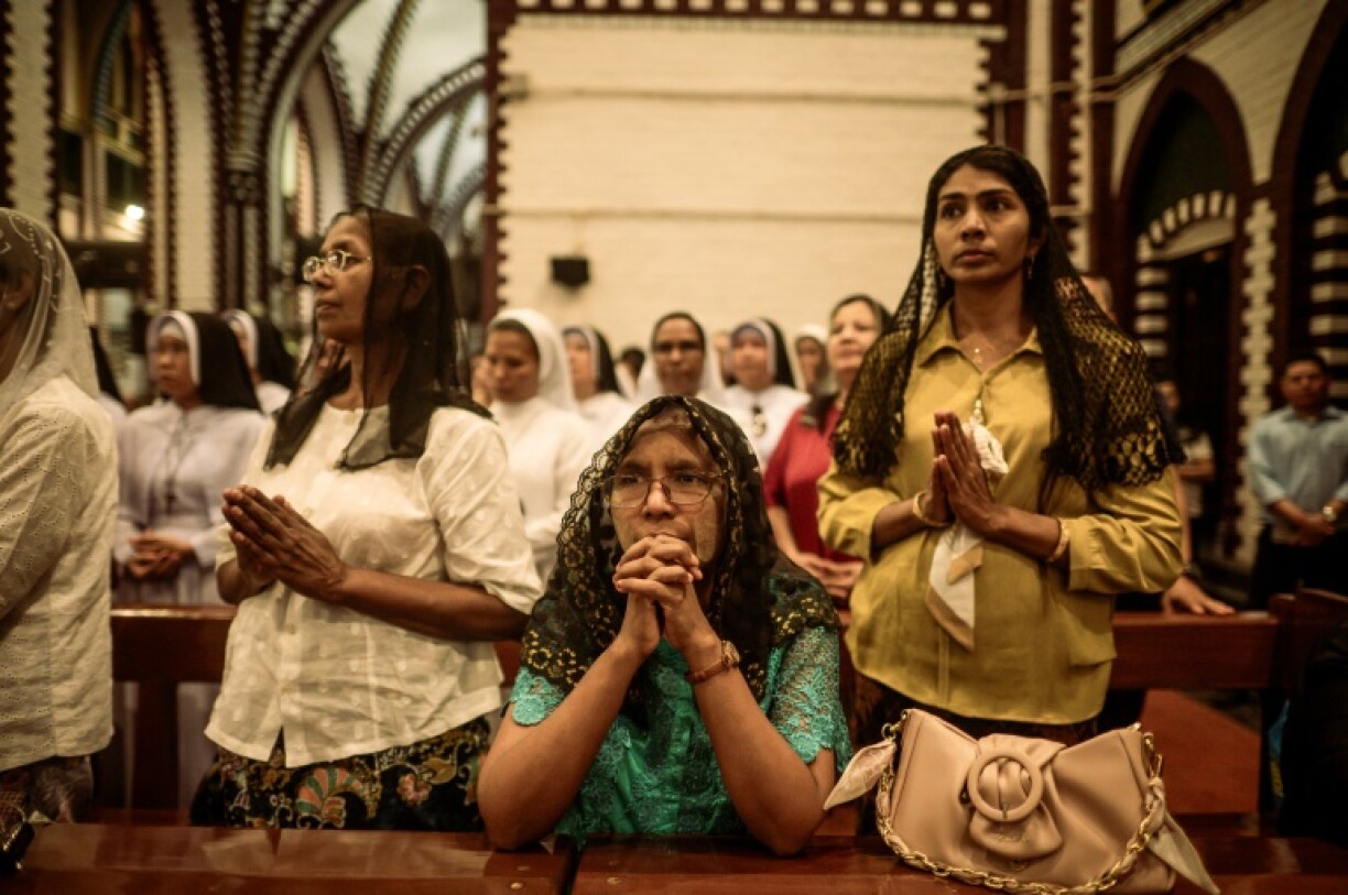 Faithful pray in memory of the late Pope Francis at St Mary’s Cathedral in Yangon
