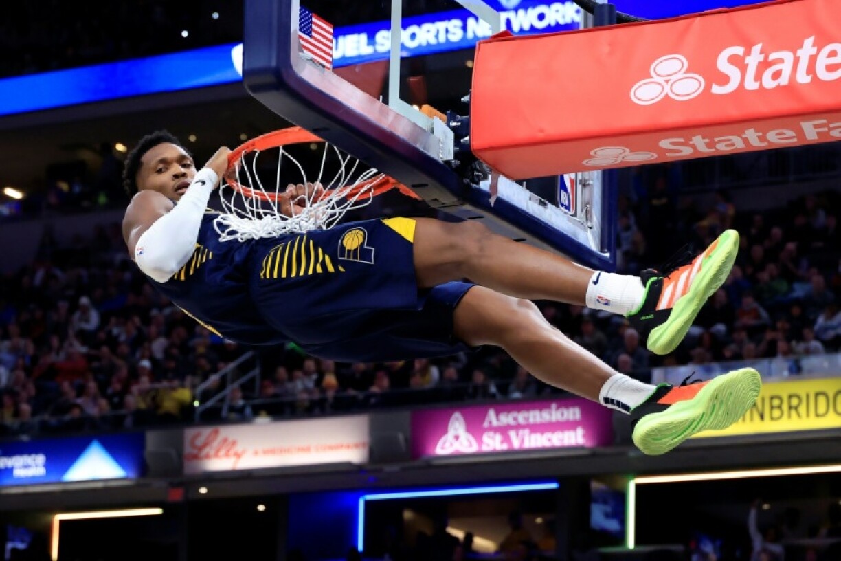 Bennedict Mathurin of the Indiana Pacers hangs on the rim after a dunk, drawing a technical foul in the Pacers' loss to the Cleveland Cavaliers