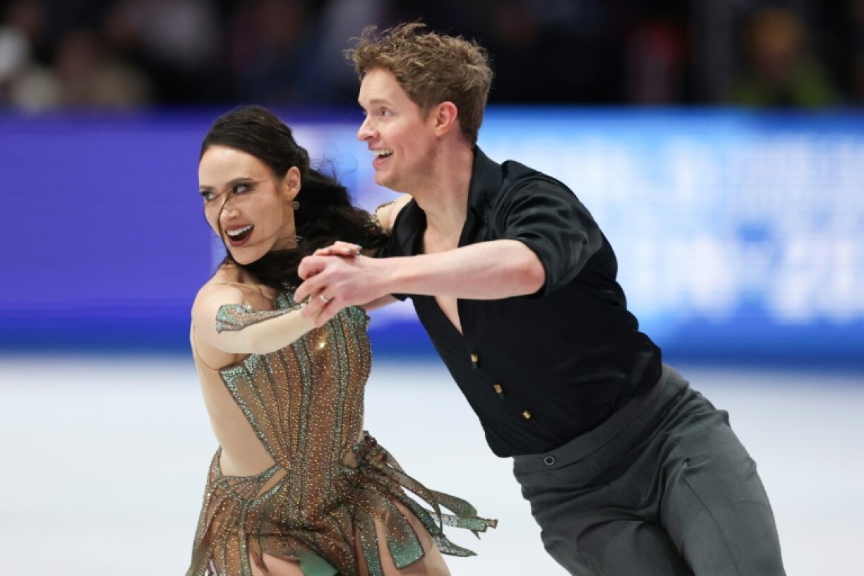 Americans Madison Chock and Evan Bates compete in free dance on the way to a third straight ice dance world title