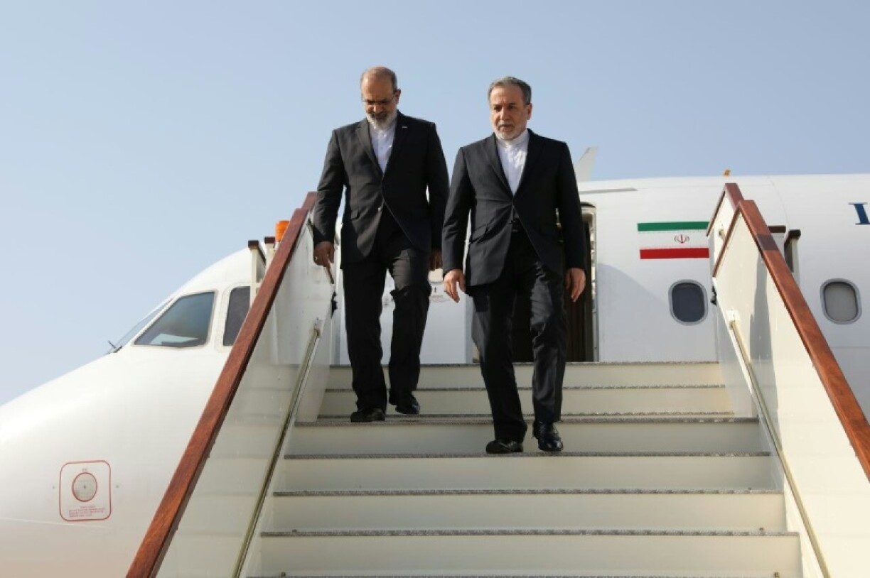Iran's Abbas Araghchi (R) arrives in Muscat ahead of nuclear talks with the United States