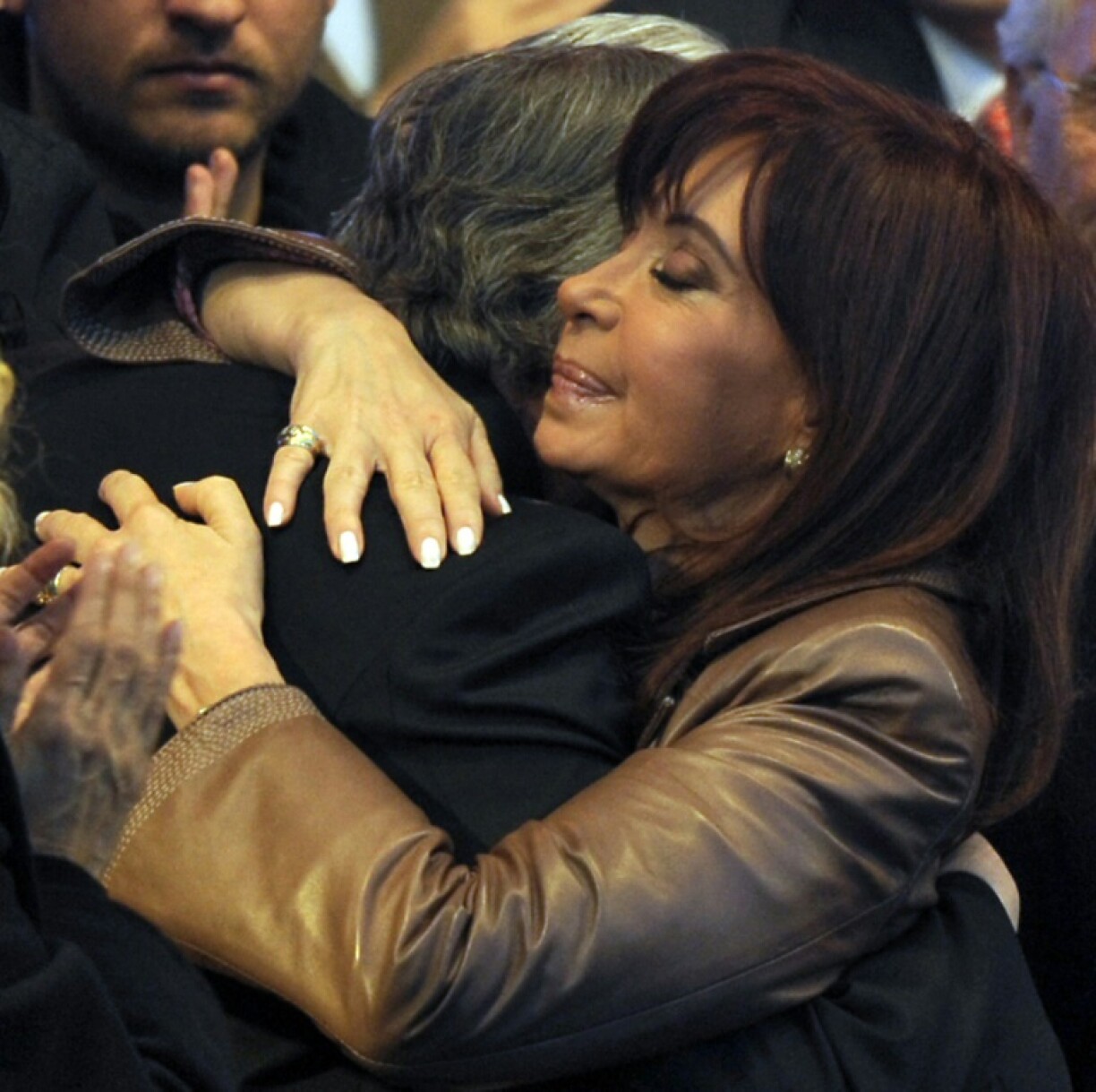 Argentina's Cristina Fernandez de Kirchner embraces her late husband Nestor Kirchner, in 2009