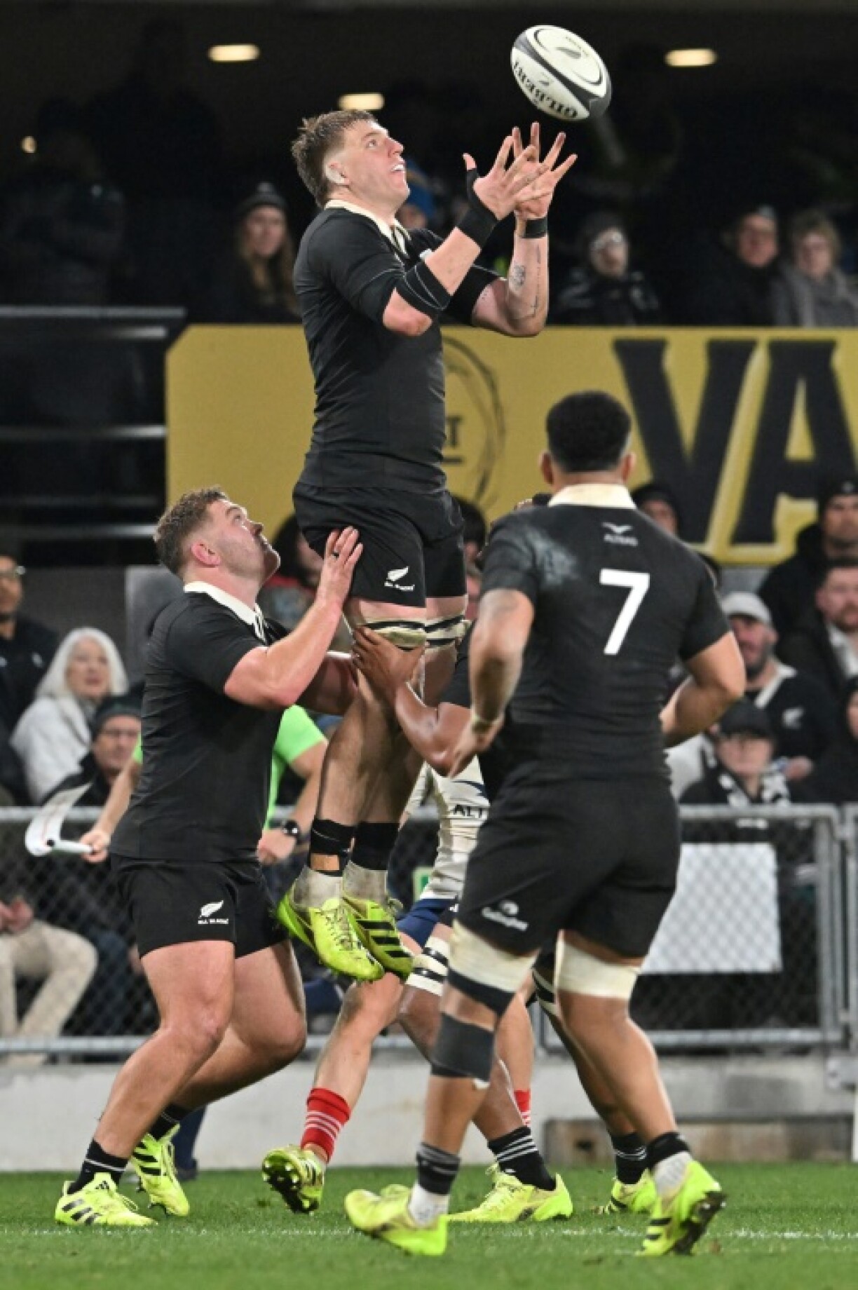 New Zealand's Fabian Holland (C) secures the ball during the first international rugby Test match between New Zealand and France at Forsyth Barr Stadium in Dunedin