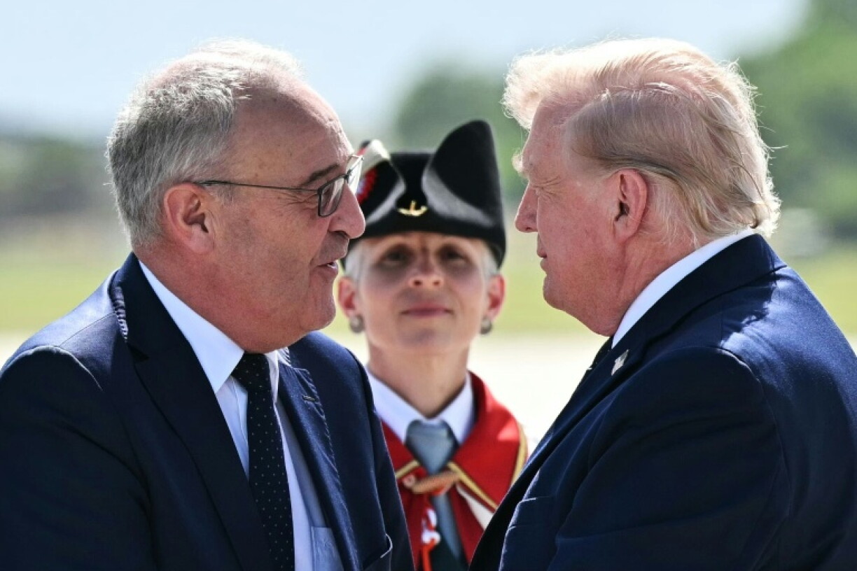 Switzerland's President Guy Parmelin (L) welcomes US President Donald Trump to Geneva ahead of the G7 summit in Evian