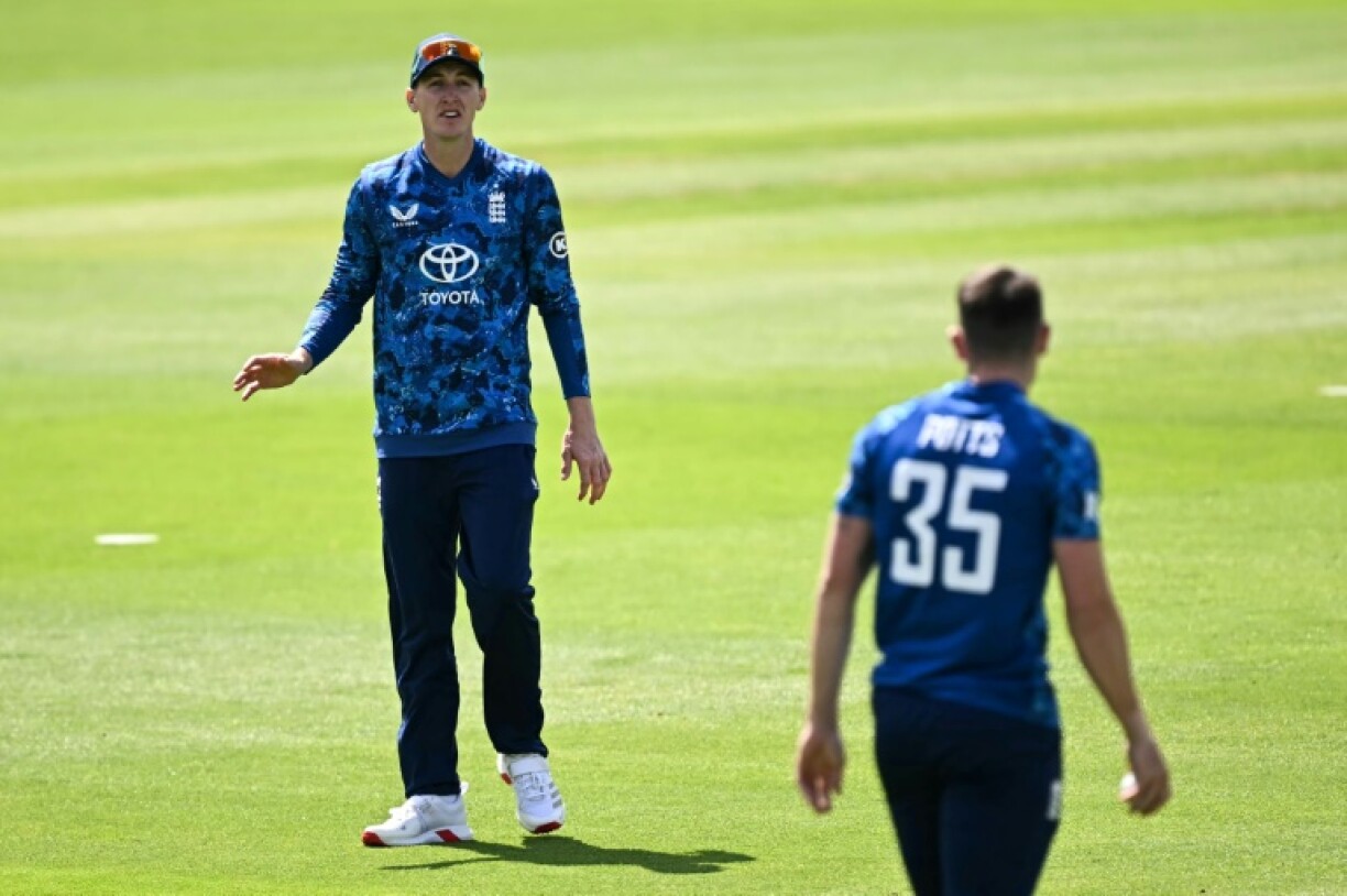 England captain Harry Brook (L) speaks to Matthew Potts during the second ODI against the West Indies in Cardiff