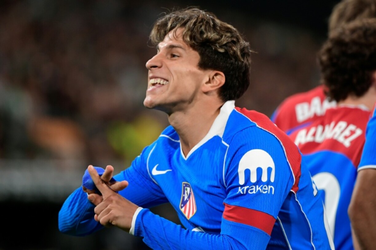 Atletico Madrid's Argentine forward Giuliano Simeone celebrates after scoring their first goal in the win at Real Betis