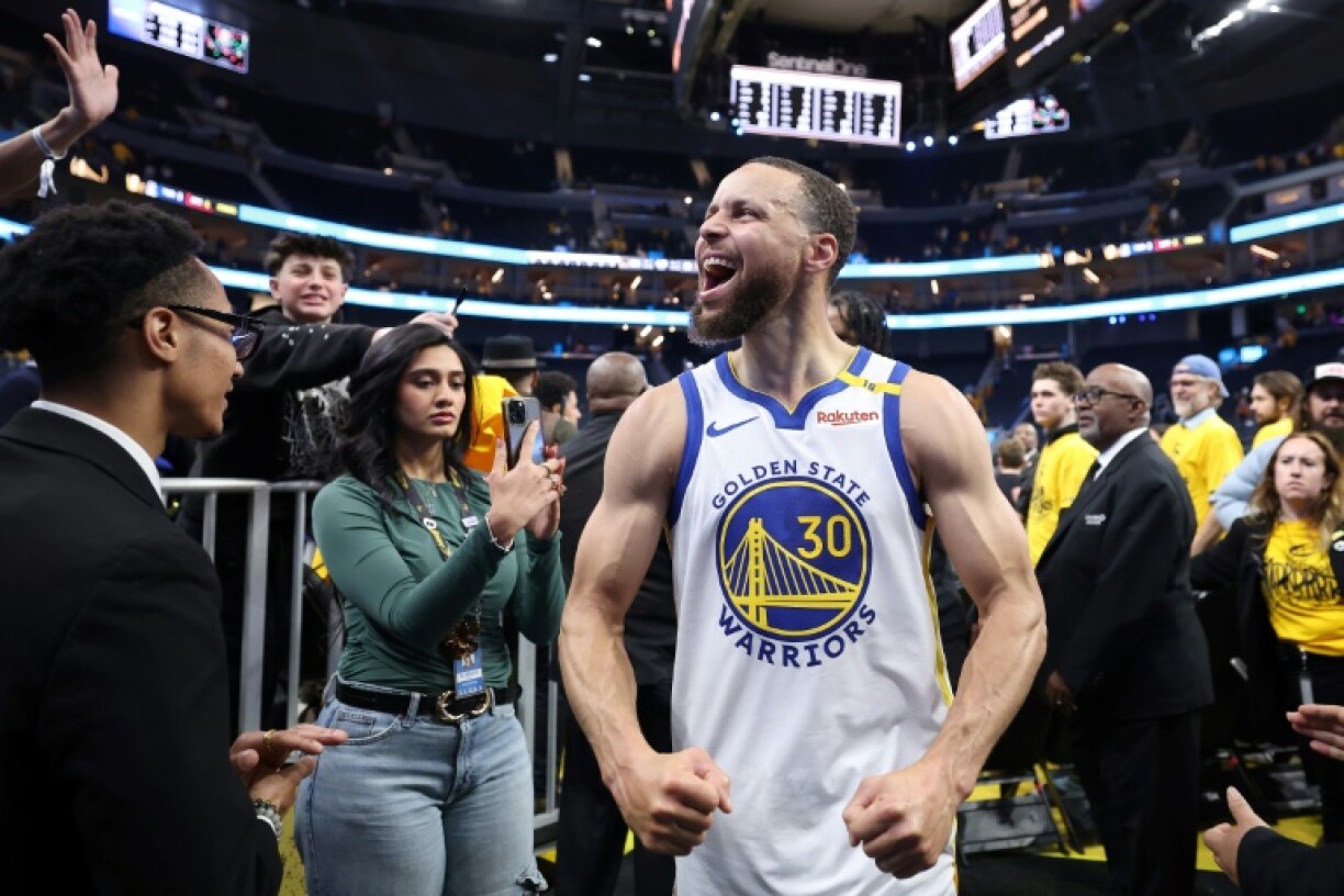 Stephen Curry of the Golden State Warriors celebrates his team's victory over the Houston Rockets in game three of their NBA playoff series