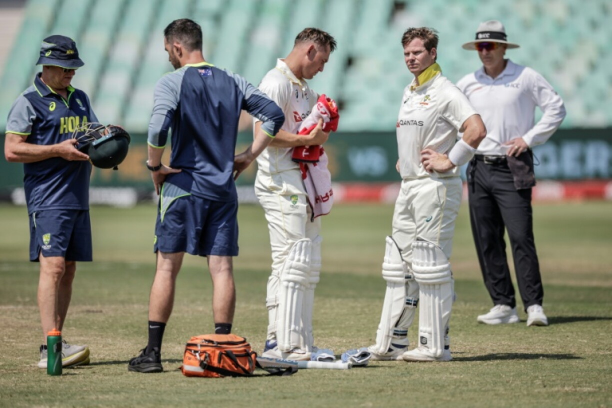 Steve Smith was assessed after being struck on the helmet by Anrich Nortje