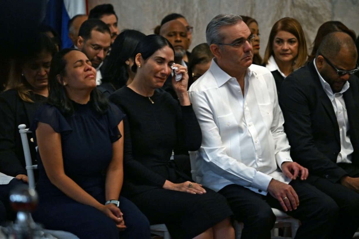 Relatives of singer Rubby Perez are joined by Dominican Republic President Luis Abinader (2-R) at a memorial service for the merengue singer, who was on stage when the roof of the Jet Set club collapsed, killing over 200 people