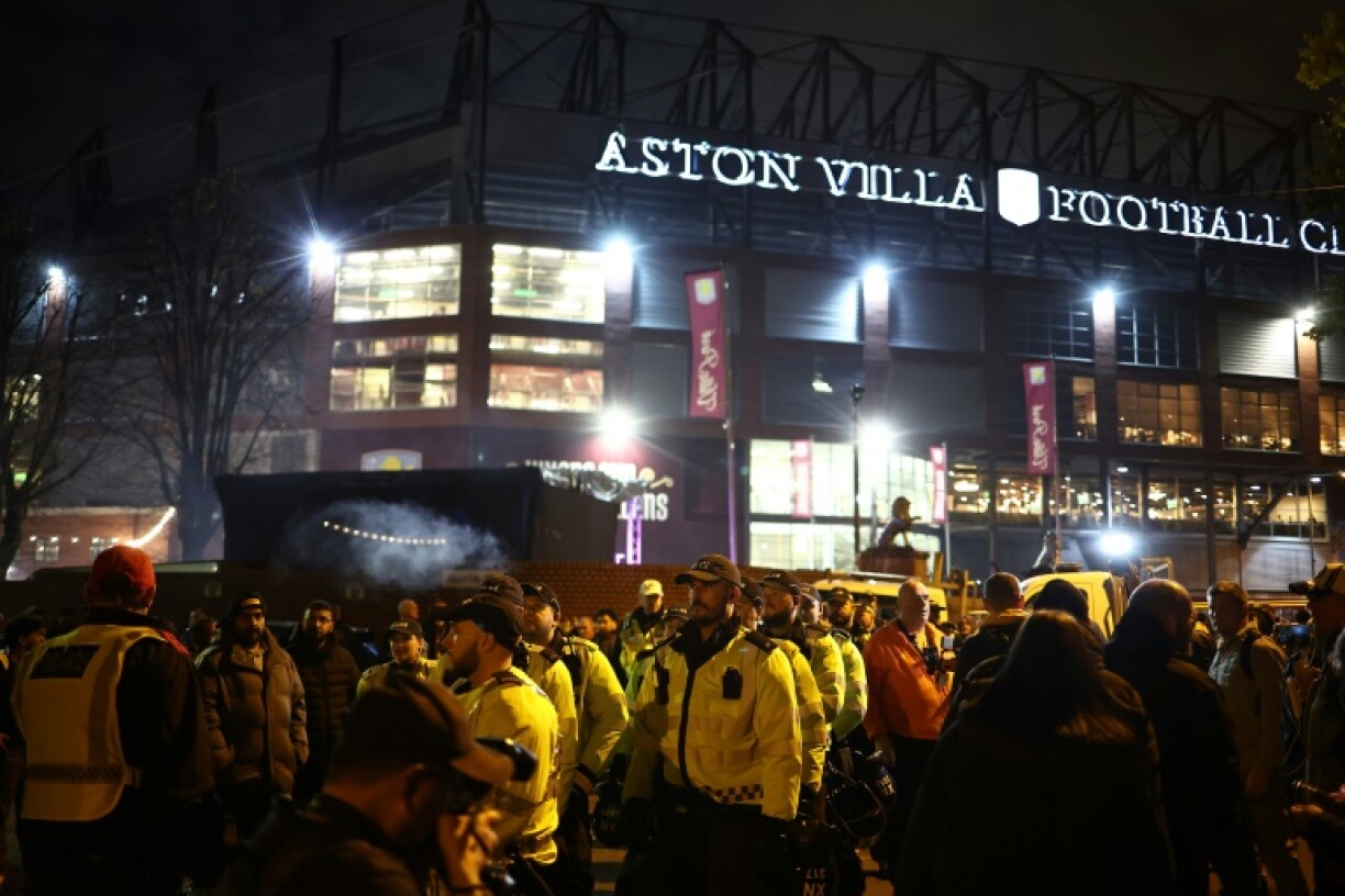 Police officers surround a pro-Palestinian demonstration outside Aston Villa's stadium before they played Israel club Maccabi Tel Aviv