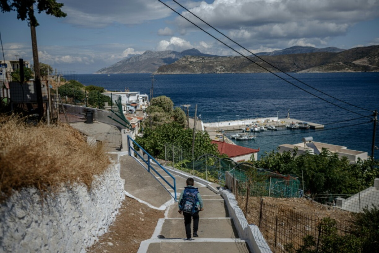 Lonely path: Minas, one of only two primary school pupils left on the Greek island of Thymaina