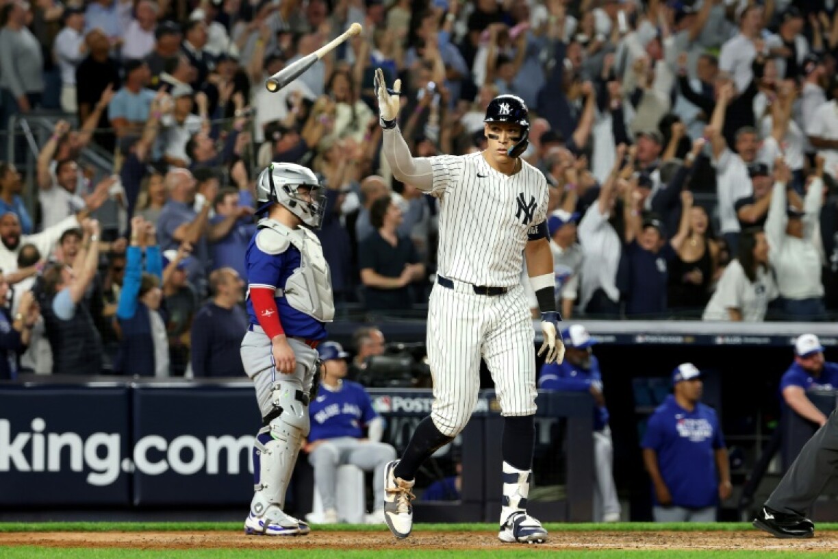New York Yankees slugger Aaron Judge celebrates hitting a three-run home run against Toronto in an MLB playoff victory at Yankee Stadium