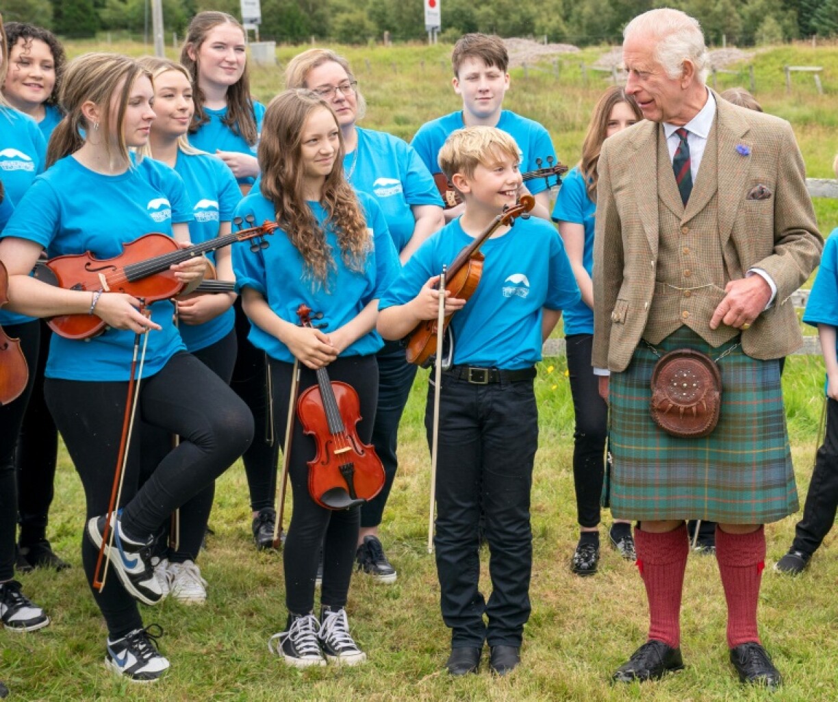 Britain's King Charles III meets members of a community music group in northern Scotland