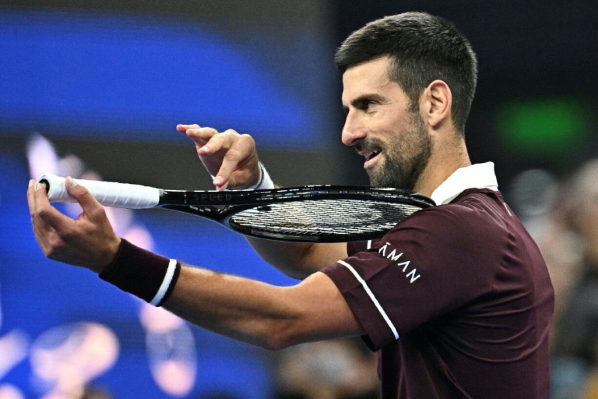 Serbia's Novak Djokovic celebrates his victory over Germany’s Alexander Zverev during their men’s singles quarter-final at the China Open tennis tournament in Beijing on October 4, 2026.