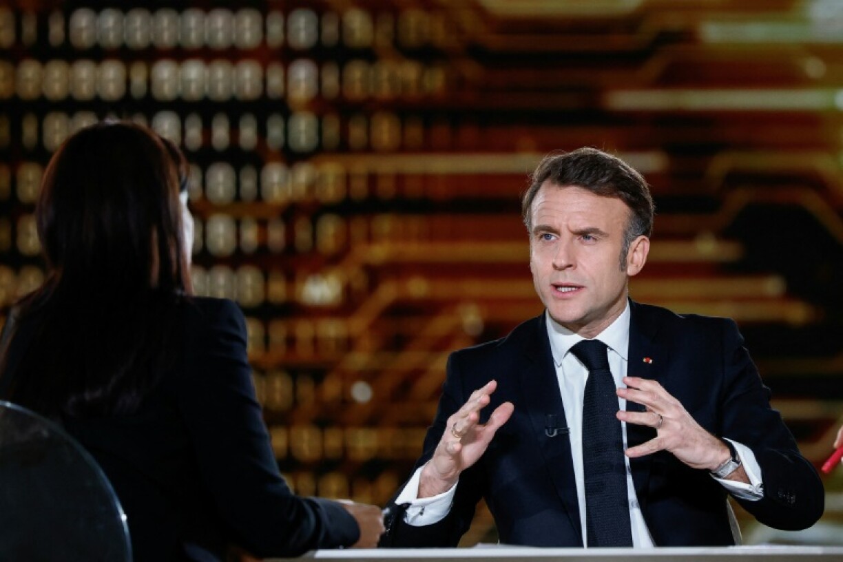 Macron (R) talked up French tech firms in a TV interview