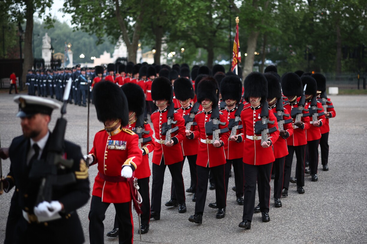 Members of the Genadier Guards return to Wellington Barracks after taking part in a Guard of Honour at Buckingham Palace, a rehearsal for the VE (Victory in Europe) Day 80 procession in central London on May 3, 2025
