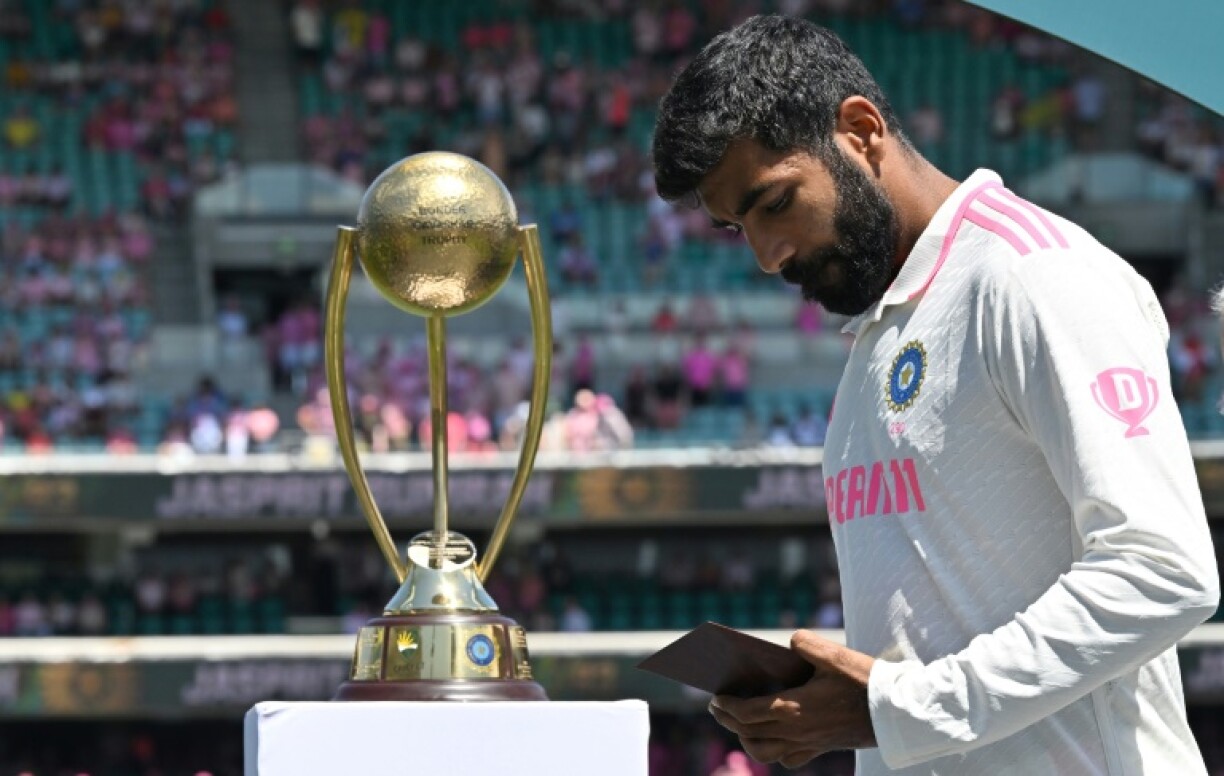 India’s Jasprit Bumrah looks at his Player of the Series award after the fifth and final Test in Sydney