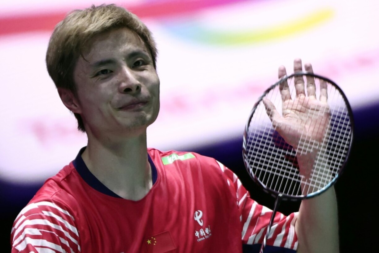 China's Shi Yuqi celebrates booking his spot in the world championships final