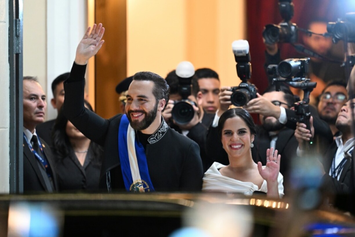 El Salvador's President Nayib Bukele and his wife Gabriela Rodriguez leave the National Theatre after deliver his first-year speech in San Salvador on June 1, 2025.