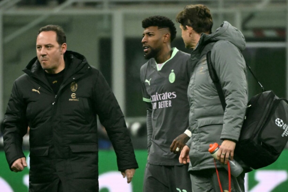 AC Milan's Brazilian defender Emerson Royal left the pitch injured during the UEFA Champions League match against Girona at the San Siro stadium in Milan