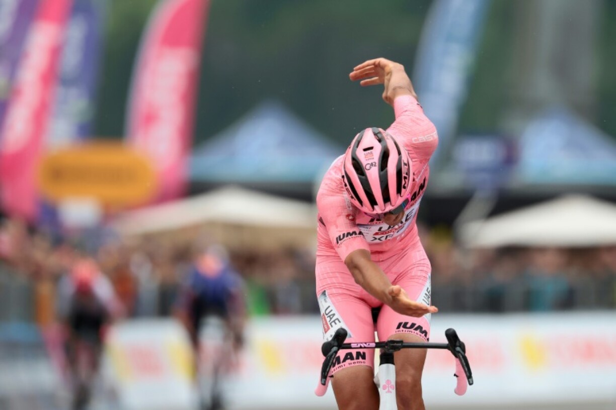 Isaac Del Toro bows in celebration after winning the 17th stage of the Giro d'Italia