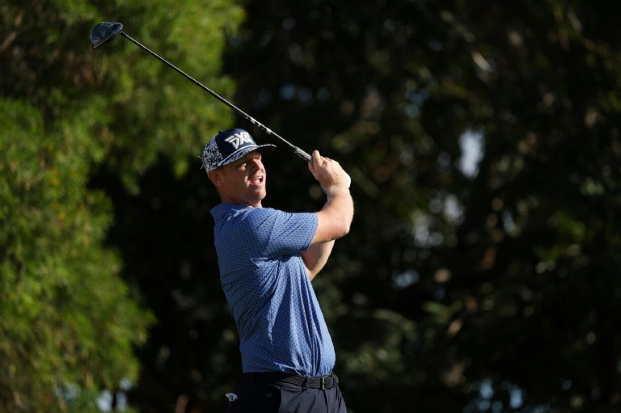 Patrick Fishburn's fired a 65 to take a share of the lead at the halfway stage of the PGA Tour's Sony Open in Hawaii on Friday