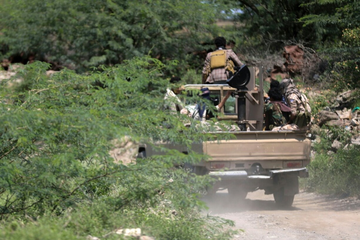 Saudi-backed Yemen government soldiers ride in a pick-up truck near the Jabal Han front, west of the city of Taiz, where battles are ongoing