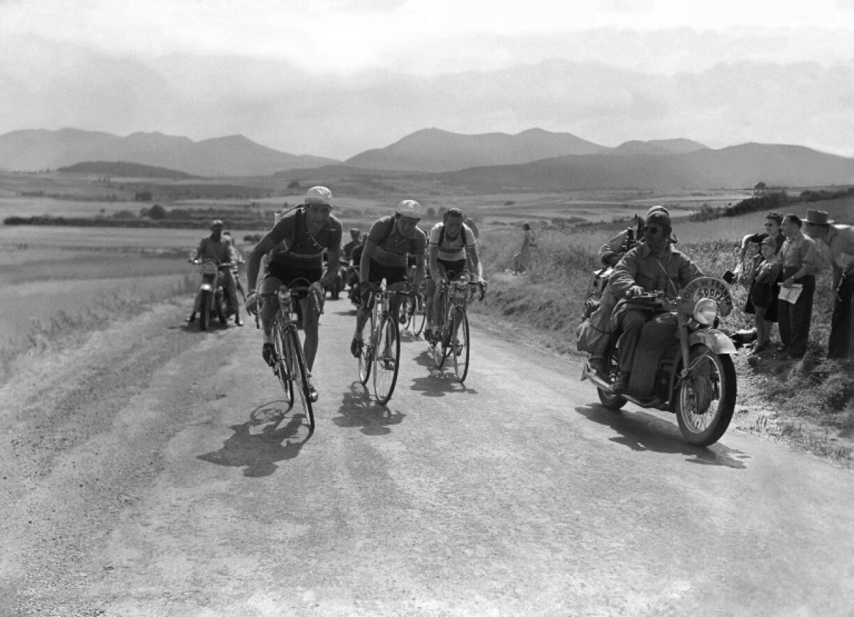 From left, Italian Gino Bartali, French cyclist Jacques Marinelli and Dutch rider Jan Nolten compete in the Tour de France in 1952