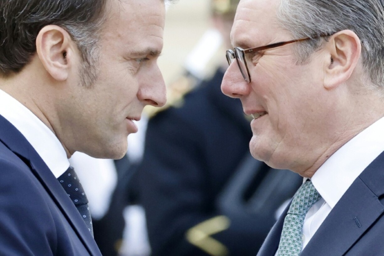 Britain's Prime Minister Keir Starmer (R) has said London could send troops