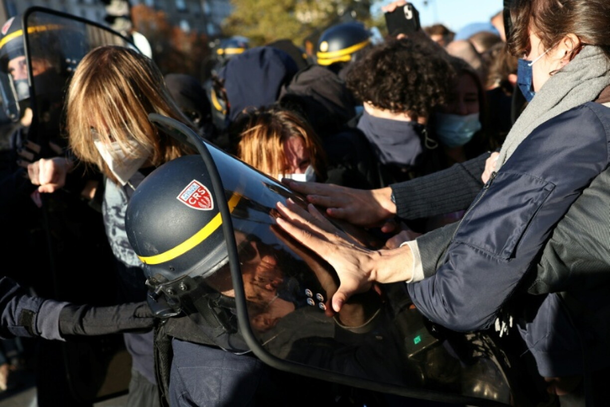 AFP saw some scuffles between riot police and protesters at a high school in Paris on Thursday