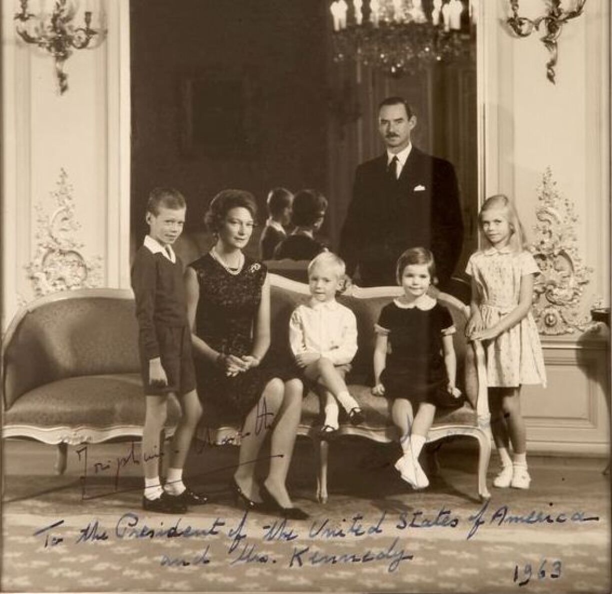 A gift to President Kennedy by Grand Duchess Charlotte, signed by Hereditary Grand Duchess Joséphine-Charlotte and dated 1963. Prince Henri can be seen standing next to his mother. Also in the picture: Hereditary Grand Duke Jean, and Henri's siblings Princess Marie Astrid, Prince Jean and Princess Margaretha.