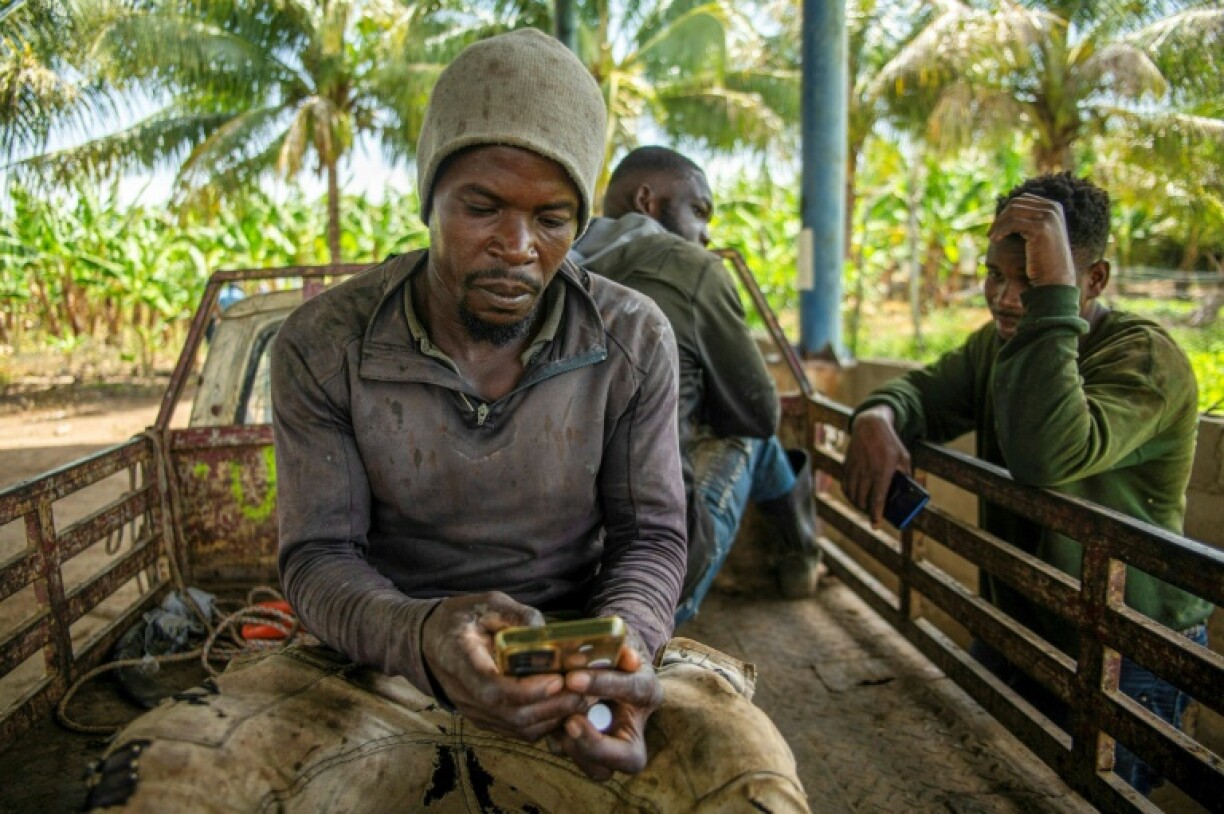 Workers take a break from picking bananas in the Dominican Republic