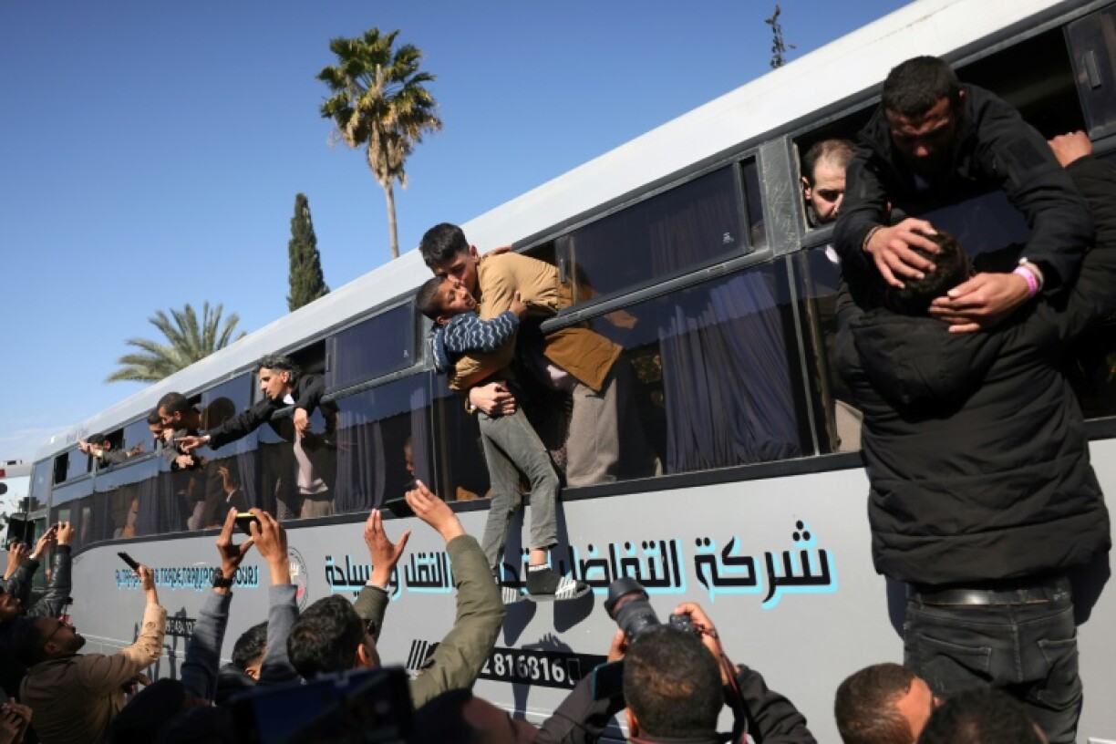 A busload of former Palestinian prisoners, released as part of a ceasefire exchange, arrive in southern Gaza on Saturday