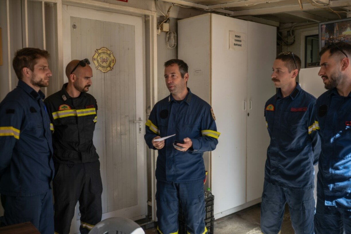Apollos Kounis, centre, says protecting the mountain forests is his 'life'