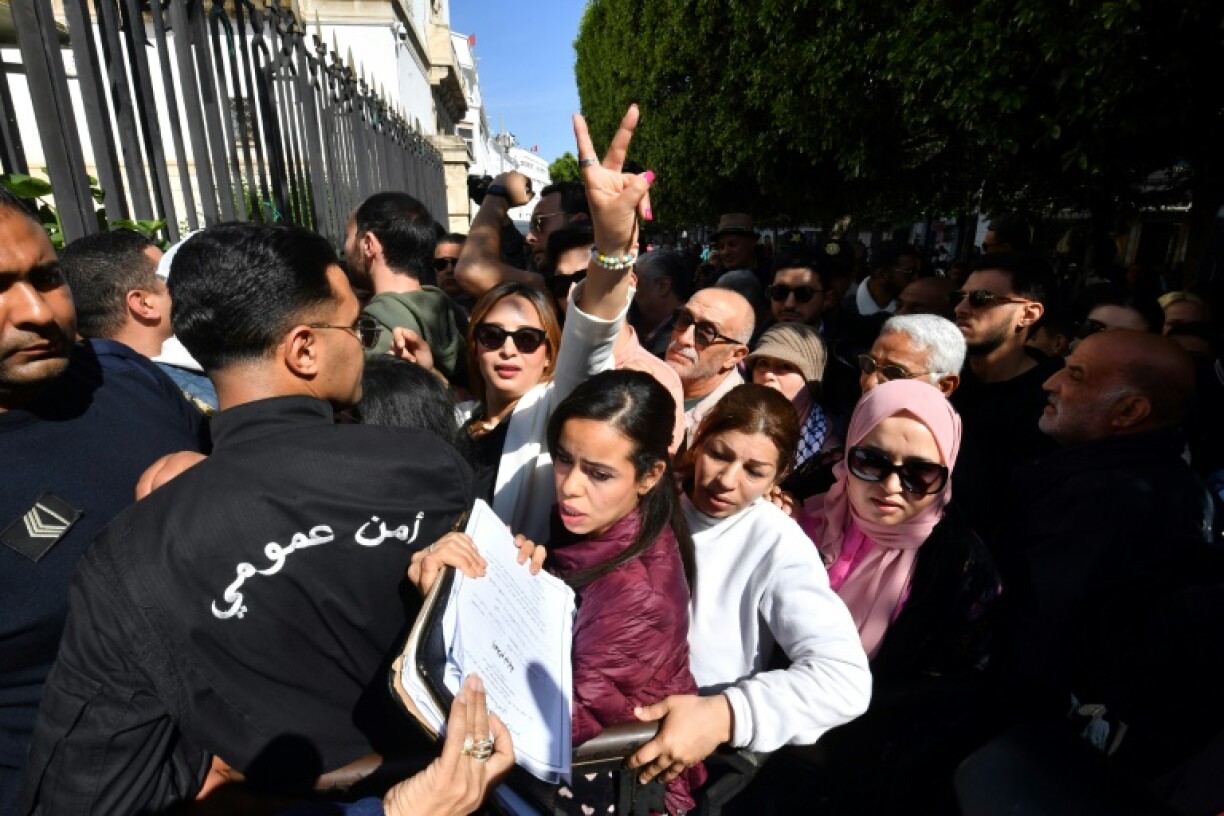 Journalist and rights activist Chaima Issa, seen flashing the victory sign outside the court on April 11, 2025, was sentenced to 18 years