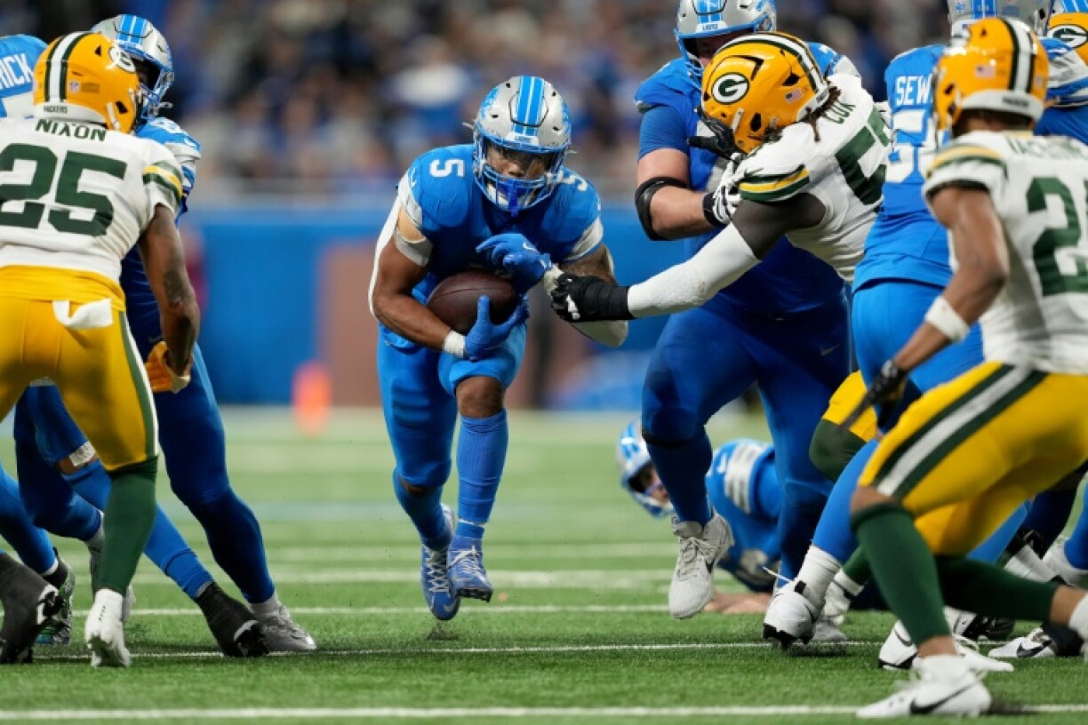 David Montgomery of the Detroit Lions runs for a first down in the Lions' NFL victory over the Green Bay Packers