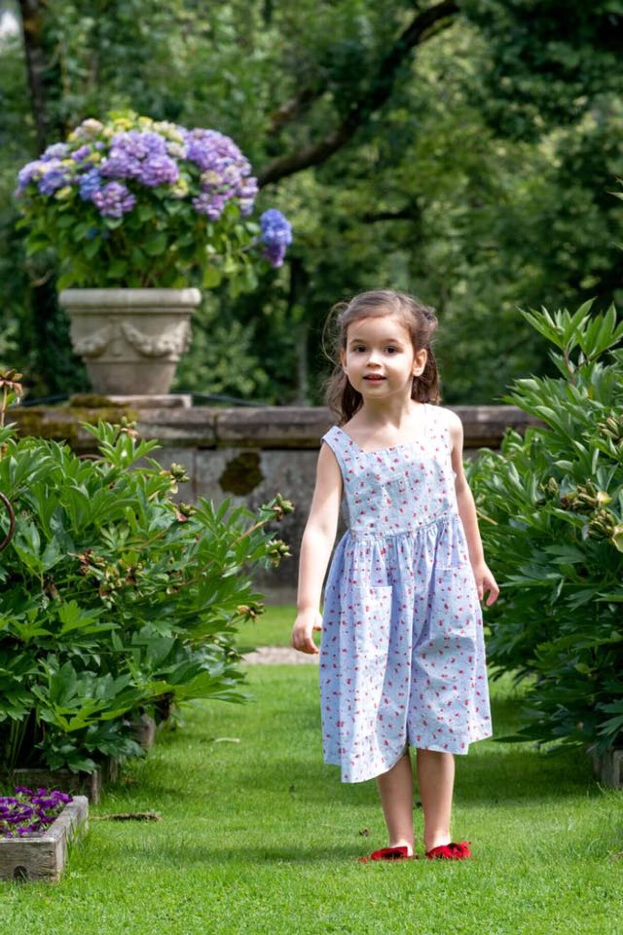 Princess Amalia enjoying the outdoors, looking very inquisitive.