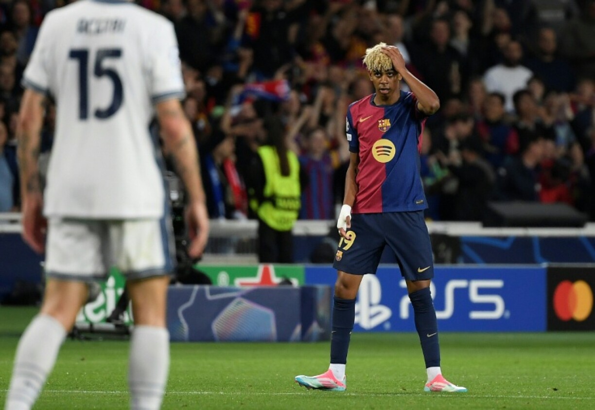 Barcelona forward Lamine Yamal celebrates scoring his team's first goal against Inter Milan