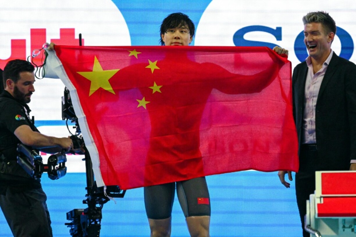 China's Qin Haiyang won the men's 100m breaststroke at swimming's world championships in Singapore on MOnday